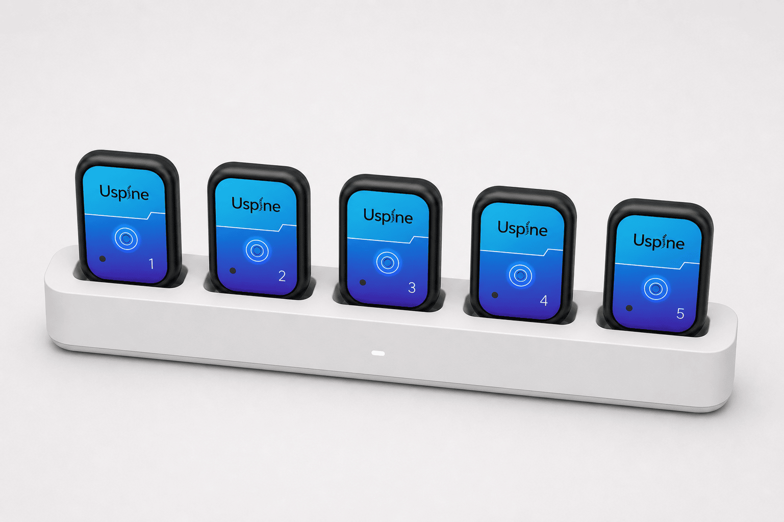 Uspine Pro five-sensor set in its charging dock